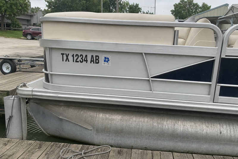 TX 1234 AB · 3" black on a pontoon rail. Textured aluminium, high-tack as standard.
